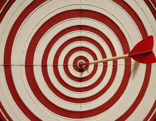 Red dart arrow in the center of a target on a red background