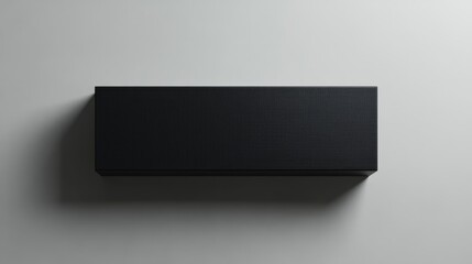 This image showcases a blank black wine box mockup, perfect for showcasing your wine label designs. The box sits on a light gray background, creating a clean and minimalist aesthetic. It symbolizes so