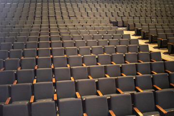Fototapeta premium Empty seats in the auditorium. Seats for spectators. Rows of seats.