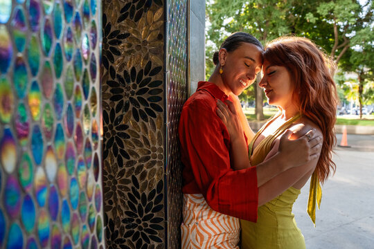 Intimate moment of a lesbian couple embracing outdoors