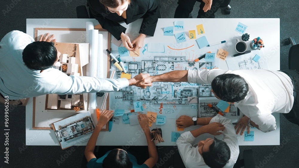 Aufkleber top aerial view of manager shaking hand and making contract at meeting table with blueprint and hous