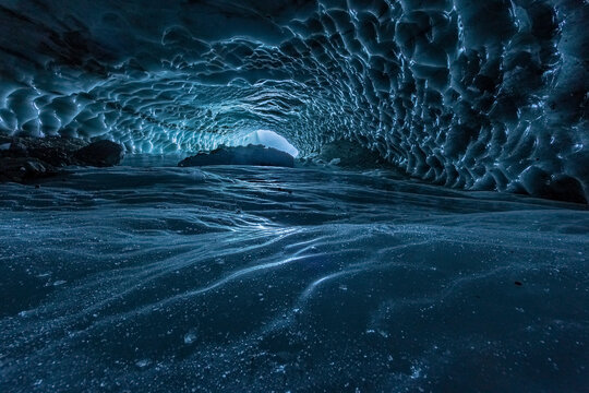 Ice cave with intricate frozen patterns and textures