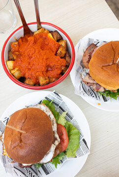 Appetizing burgers and fries served on a table