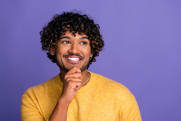 Photo of interested funny man wear trendy yellow clothes look empty space isolated on violet color background