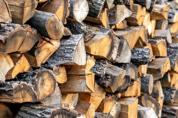 stacked firewood for burning in the fireplace, firewood texture