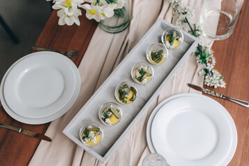 Elegant Herb-Garnished Appetizers on Wooden Table