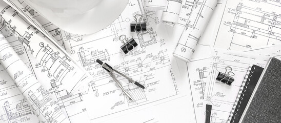 architect design working drawing sketch plans blueprints and making architectural construction model in architect studio,flat lay.