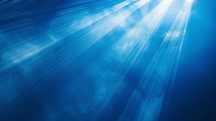 Obraz premium Beams of spotlight on a royal blue background.