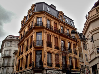Aix-les-Bains, France - December 11th 2012 : old yellow building in the city, maybe in art deco style.  