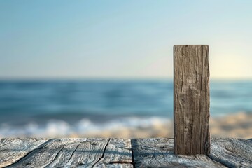 A weathered wooden post stands on a rustic dock overlooking a calm sea, creating a serene waterfront atmosphere.