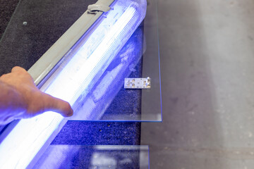 Gluing hinges to glass with UV glue