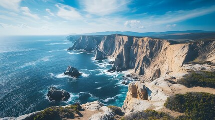 Obraz premium An awe-inspiring stock photo of a dramatic coastal cliff overlooking the ocean.