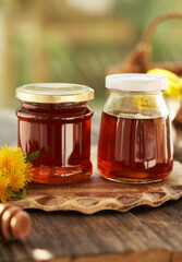 Two jars of dandelion honey - syrup made of fresh dandelion flowers in spring