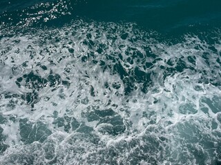 Sea spray waves with rich deep blue and turquoise tones Gulf of Thailand