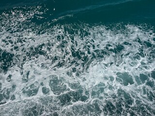 Sea spray waves with rich deep blue and turquoise tones Gulf of Thailand