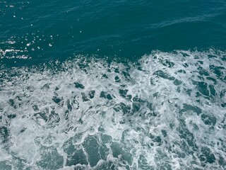Sea spray waves with rich deep blue and turquoise tones Gulf of Thailand