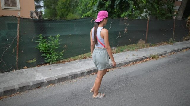 A Young Woman Joyfully Walking in a Lively Urban Environment Filled with Life and Beauty