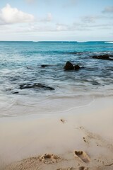 Fototapeta premium A tropical blue ocean with clear waters with white sand at the bottom. 