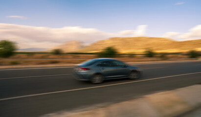 Blurred Car Speeding Along a Scenic Road in Turkey