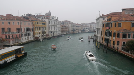 Venice in December, shrouded in mist and without sunlight, captures a serene and atmospheric winter beauty. Historic canals, iconic landmarks, and a tranquil ambiance define this unique, foggy scene.