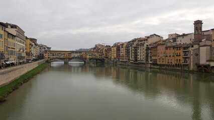 Florence, Italy - decembre 27 2024: Sunny Tuscany with iconic Ponte Vecchio, Florence skyline historic architecture, Arno River reflections. A colorful blend of Renaissance culture, medieval landmarks