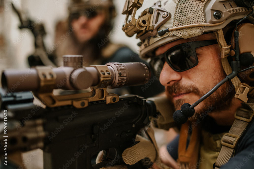 Wall mural close up of shooter aiming with sniper rifle at opponent on a battlefield