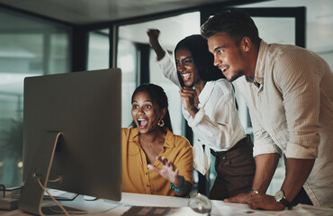 Business people, computer and celebration in office for feedback, collaboration or teamwork. Women, man and tech for cooperation in working late for project, corporate pitch or proposal with success