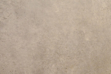 Obraz premium Textured background. Decorative plaster walls, external decoration of facade. Texture of beige paint on the wall.