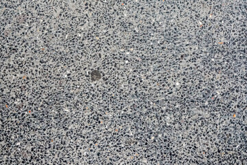 rough gray asphalt pavement surface, showcasing its detailed texture and fine gravel composition. Perfect texture for various design projects.Stone wall fence background