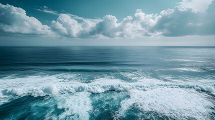 Fototapeta premium A majestic ocean view from a lighthouse with waves crashing against the shore and the vast sea stretching out to the horizon.