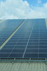 the rooftop of factory warehouse. renewable energy of photovoltaic for reduce energy and carbon footprint. clean energy.solar panels producing clean green renewable energy of factory warehouse.