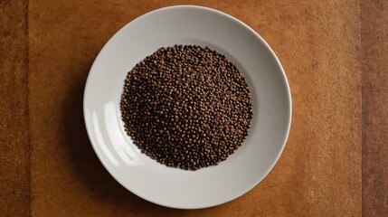 A Mustard Seeds in the plate, Indian spices top view images.