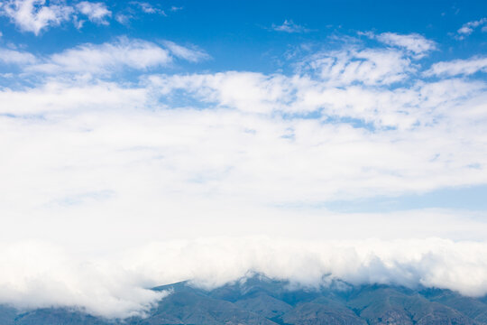 white cloud on mountains on coast of Lake Sevan