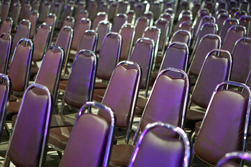 Naklejka premium The atmosphere of a large conference room with rows of chairs.