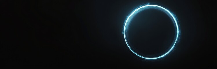 A glowing circular shape against a dark background with vibrant blue tones during nighttime