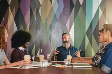 Creative, people and meeting with discussion in cafe for project planning, ideas and feedback of collaboration. Staff, drinks and paperwork with communication, proposal and productivity at restaurant