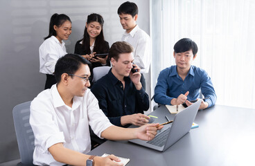 Group of diverse office worker employee working together on strategic business marketing planning in corporate office room. Positive teamwork in business workplace concept. Prudent