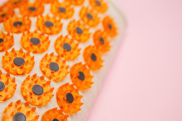 Acupuncture Massage Pillow with Spiky Tips on Pink Background