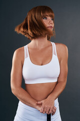 Thinking, exercise and woman with hockey stick, idea and model on gray studio background. Athlete, girl and sportswear for workout, wellness and health challenge with confidence and proud energy