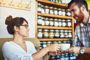 Cafe, woman and man with coffee, service and waiter with smile for customer, happy or relax in...