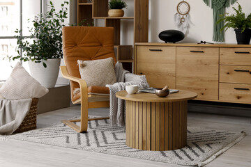Interior of living room with armchair, glucophone and Tibetan singing bowl