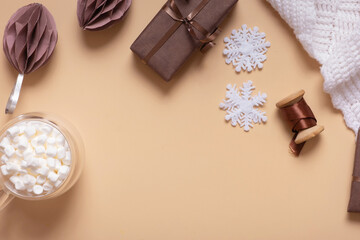 Christmas flat lay composition with gifts, paper balls, plaid and marchmellow top view
