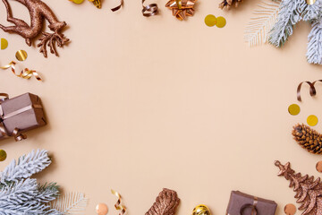 Christmas flat lay frame composition with gifts, cones, pine top view. Copy space