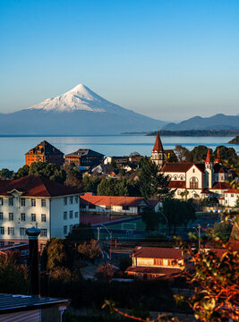 Skyline of the city of Puerto Varas on a clear and sunny winter day, with the Osorno volcano by Lake Llanquihue, Chilean Patagonia.