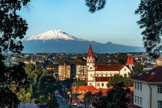 Skyline of the city of Puerto Varas on a clear and sunny winter day, with the Calbuco volcano by Lake Llanquihue, Chilean Patagonia.