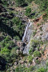 Hiking trail to waterfalls over river Caballos, Sierra de la Nieves National Park in Tolox, Malaga, Spain