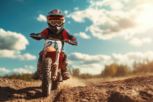 Young child racing in motocross on a motorcycle an adventurous sport