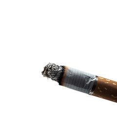Burning Cigarette With Smoke Rising Against a Black Backdrop