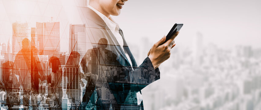 Double Exposure Image of Business Communication Network Technology Concept - Business people using smartphone or mobile phone device on modern cityscape background. uds - Powered by Adobe