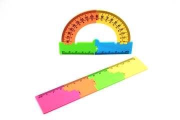 multi-colored plastic ruler and protractor